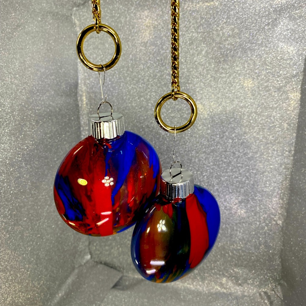 Set of two handcrafted ornaments, flat shaped, red orange and blue
